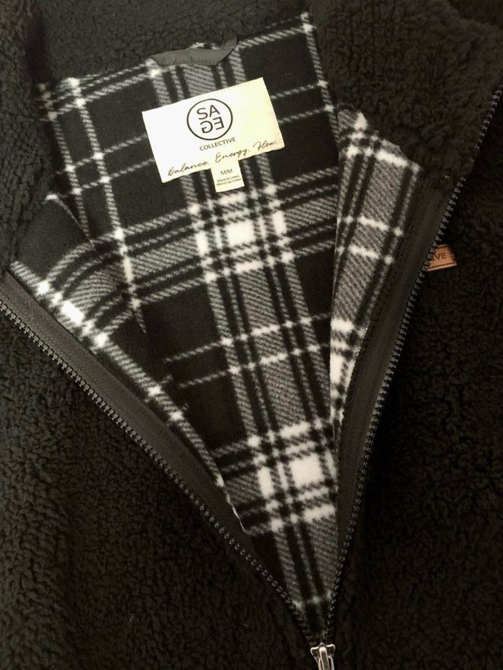 Super fuzzy black and white plaid zip-up fleece vest